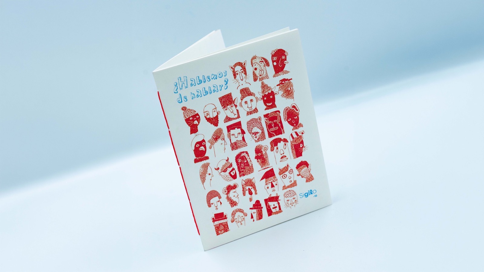 Portada del fanzine Hablemos de hablar con personajes ilustrados en rojo